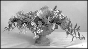 A vase with purple flowers Description automatically generated with low confidence